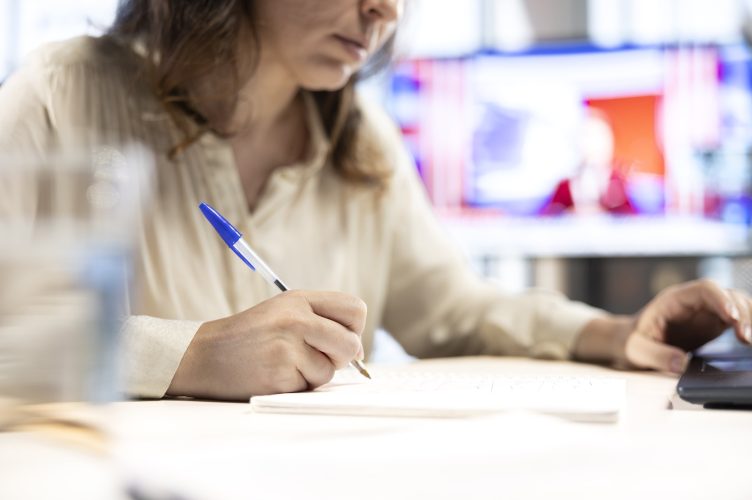 business-director-holding-pen-sign-documents-contract-negotiations-min business-director-holding-pen-sign-documents-contract-negotiations-min